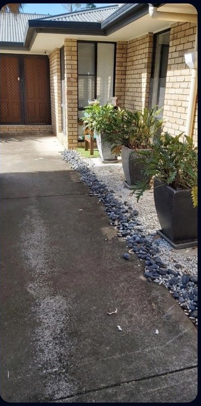 Driveway before pressure cleaning — stained and grimy